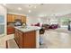 Island kitchen with granite countertops and views to Gathering room at 7070 Cinder Horse St, Las Vegas, NV 89131