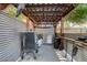 Covered outdoor kitchen with grill and smoker at 7310 Heggie Ave, Las Vegas, NV 89131