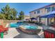 Stunning pool and spa with patio furniture and lush landscaping at 7310 Heggie Ave, Las Vegas, NV 89131