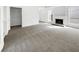 Bright living room featuring a fireplace and carpet flooring at 6609 Pepperidge Way, Las Vegas, NV 89108