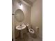 Powder room with pedestal sink and toilet at 2818 Turnstone Ridge St, Henderson, NV 89044