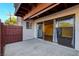 Covered patio with sliding glass doors and wood fence at 870 B # 606, Boulder City, NV 89005