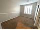 Bedroom with carpet flooring and window with shutters at 2361 Thayer Ave, Henderson, NV 89074