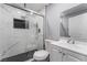 Modern bathroom with marble shower, white vanity, and hexagon floor tiles at 1225 Lawry Ave, Las Vegas, NV 89106