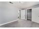 Bedroom with grey walls, vinyl flooring and access to bathroom at 1225 Lawry Ave, Las Vegas, NV 89106