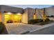 Modern glass garage door and landscaping at 455 Tranquil Peak Ct, Henderson, NV 89012