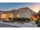 Contemporary home exterior featuring a red door and well-manicured landscaping at 455 Tranquil Peak Ct, Henderson, NV 89012