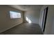 Bright bedroom featuring wood-look floors and a sliding door closet at 5116 Gray Ln # H, Las Vegas, NV 89119