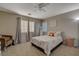 Cozy bedroom with window seating and ceiling fan at 6012 Valley Flower St, North Las Vegas, NV 89081