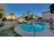 Relaxing backyard with a kidney-shaped pool and ample lounge space at 6012 Valley Flower St, North Las Vegas, NV 89081