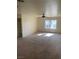 Bright living room with carpeted floor and ceiling fan at 2004 Mesquite Ln # 201, Laughlin, NV 89029