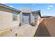 Modern home exterior featuring a gray front door and courtyard at 4484 E Cactus Canyon Dr, Pahrump, NV 89061