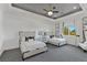 Bright bedroom featuring two twin beds, a window, and a ceiling fan at 27 Eagles Landing Ln, Las Vegas, NV 89141