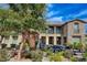 Two-story house with stone facade, balcony, and landscaping at 3995 Heldron St, Las Vegas, NV 89121