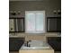 Bathroom with soaking tub, double vanity, and window at 2804 Josephine Dr, Henderson, NV 89044