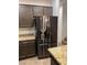 Stainless steel refrigerator in a modern kitchen with granite countertops at 1198 Narrow Gorge Ct, Henderson, NV 89002