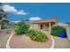 Landscaped backyard with gravel, plants, and a covered patio at 518 Feliz Contado Ct, Henderson, NV 89015