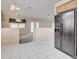 Kitchen area with black appliances and tile floor at 518 Feliz Contado Ct, Henderson, NV 89015