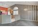 Dining room with striped wallpaper, carpet, and kitchen access at 518 Feliz Contado Ct, Henderson, NV 89015