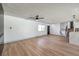 Spacious living room with hardwood floors and a view of the kitchen and stairs at 5509 Balzar Ave, Las Vegas, NV 89108