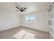 Spacious bedroom with ceiling fan and barn door at 5509 Balzar Ave, Las Vegas, NV 89108