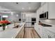 Clean kitchen with white cabinets, stainless steel appliances, and quartz countertops at 366 Spotted Dove St, Las Vegas, NV 89138