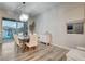 Elegant dining room with a large table, six chairs, and sliding glass doors leading to a patio at 366 Spotted Dove St, Las Vegas, NV 89138