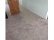 Carpeted hallway with adjacent room access at 4555 Payson Ave, Las Vegas, NV 89115