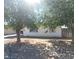 White single story home with large trees at 4555 Payson Ave, Las Vegas, NV 89115