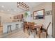 Kitchen and dining area with granite countertops and a wooden dining table at 5403 El Nevero St, Las Vegas, NV 89166