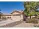 Single-story house with attached garage and desert landscaping at 1038 Silver Creek Ave, Las Vegas, NV 89183