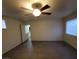 Living room with ceiling fan and view to kitchen at 4116 Mattray St, North Las Vegas, NV 89032