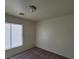 Spacious bedroom with window and neutral wall colors at 6848 Mesita Ave, Las Vegas, NV 89122