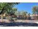 Gated community entrance with lush landscaping at 7573 Costanoa St, Las Vegas, NV 89123