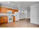 Eat-in kitchen with wood cabinets and white appliances at 4736 Arroyo Seco Dr, Las Vegas, NV 89115