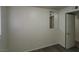 Simple bedroom with mirror and door to another room at 309 Rossmoyne Ave, North Las Vegas, NV 89030