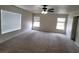 Large bedroom with carpet flooring and multiple windows at 2312 Scissortail Ct, North Las Vegas, NV 89084