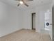 Bright bedroom with carpet flooring, ceiling fan and laundry access at 9570 Wenmarie Ct, Las Vegas, NV 89148