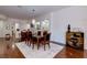 Elegant dining room features hardwood floors and stylish furniture at 3893 Burma Rd, North Las Vegas, NV 89032