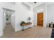 Bright entryway with light wood floors and a modern console table at 2528 Sunup Dr, Las Vegas, NV 89134