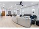 Modern living room with a curved sectional sofa and a fireplace at 2528 Sunup Dr, Las Vegas, NV 89134