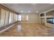 Large living room with tile floors, fireplace, and plantation shutters at 1337 Via Savona Dr, Henderson, NV 89052