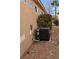 Exterior view of an air conditioning unit located on a gravel surface next to the house at 4230 Cascada Piazza Ln, Las Vegas, NV 89135