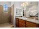 Bathroom boasts granite countertops, wood cabinets, and a shower at 537 Blanche Ct, Henderson, NV 89052