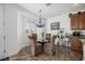 Breakfast nook with glass table and blue chandelier at 537 Blanche Ct, Henderson, NV 89052