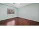 Bedroom with dark hardwood floors and vaulted ceiling at 7621 Natures Song St, Las Vegas, NV 89131