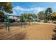 playground with multiple swings at 7621 Natures Song St, Las Vegas, NV 89131