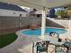 Inviting kidney-shaped pool with a patio and seating area at 7621 Natures Song St, Las Vegas, NV 89131