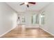 Bright living room, featuring hardwood floors and a ceiling fan at 1550 Evening Spirit Ave, Las Vegas, NV 89183