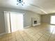 Spacious living room with tile floors and a fireplace at 6211 Bullion Blvd, Las Vegas, NV 89103